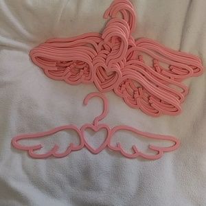 Angel wing with heart pink hangers. 16" width. Pink. Plastic. 10 hangers.